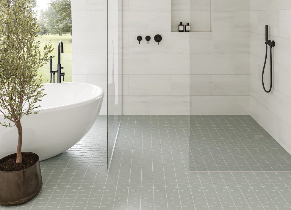Reference photo of a sage green mosaic bathroom floor beside a freestanding tub